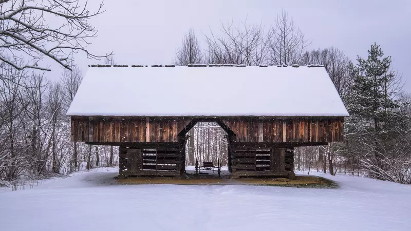 cantilever barn in Cades Cove covered in snow