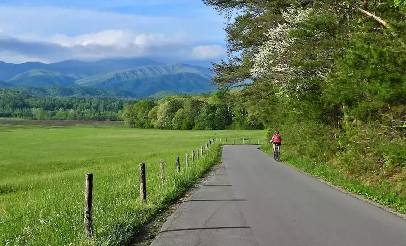 woman biking in cades cove