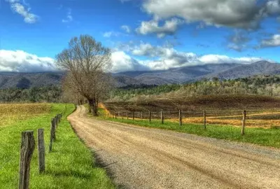 Quiet country lane with beautiful view of Smoky Mountains in Cades Cove